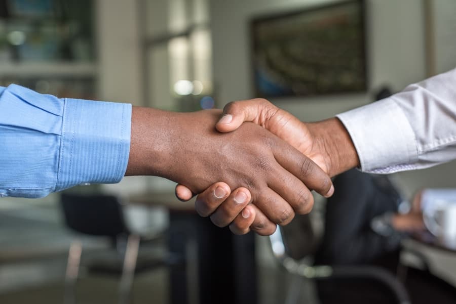 Attorney consulting with clients in a law office