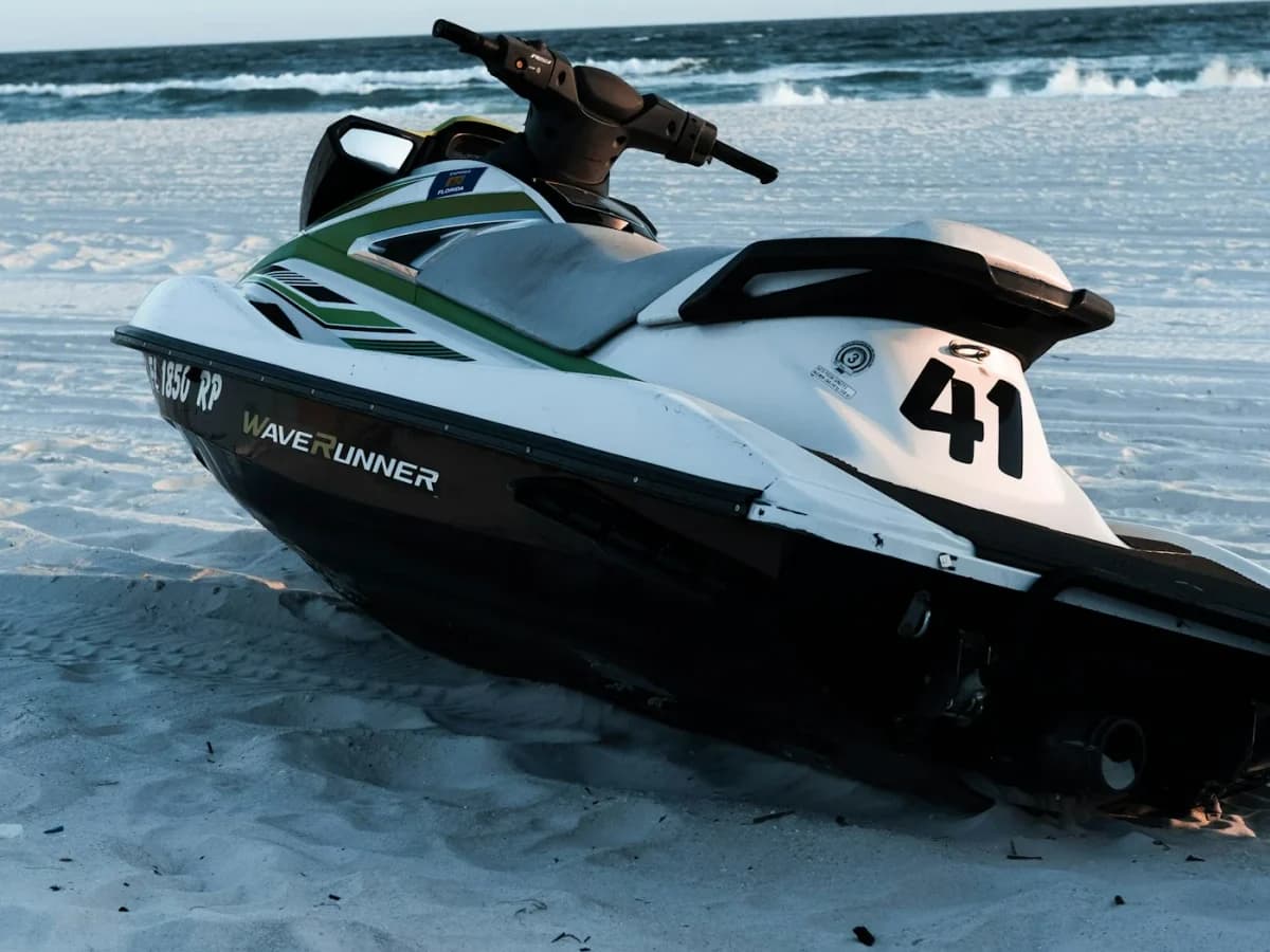 Jet ski on a white-sand Florida beach with turquoise Atlantic water