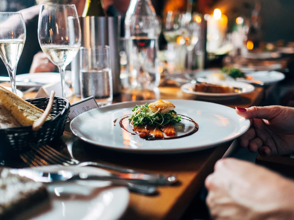 Warm Italian restaurant dining room with table setting